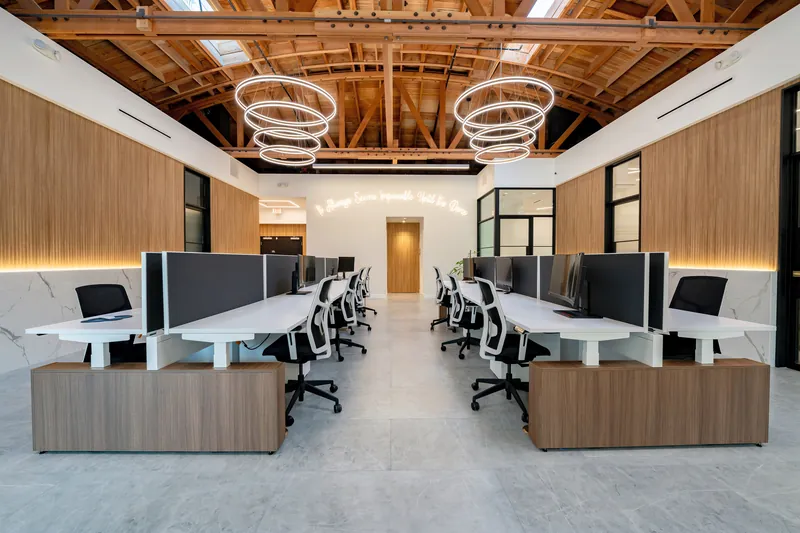 Aisle of sit-stand benching with wood end storage, Los Angeles