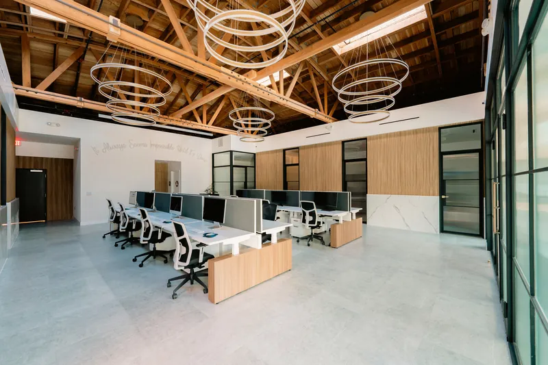 Sit-stand benching beside glass-front offices, Los Angeles