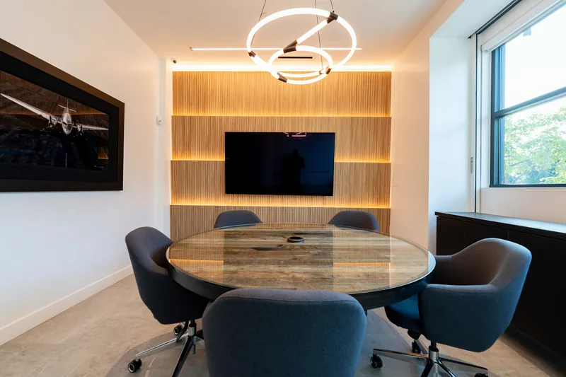 Round conference table with upholstered chairs, Los Angeles
