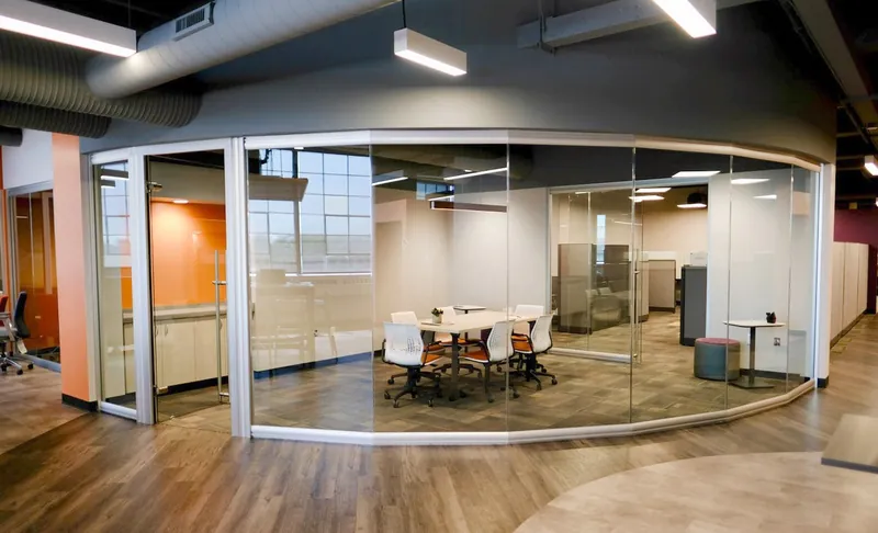 Curved floor-to-ceiling glass meeting room, manufacturer photo