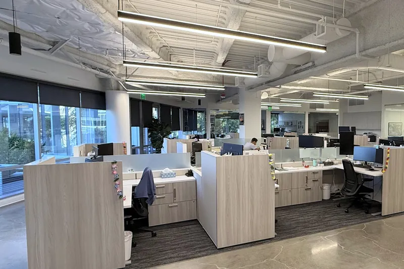 Open office with workstation rows, litigation consulting firm, El Segundo