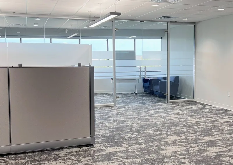 Glass meeting room with frosted privacy bands