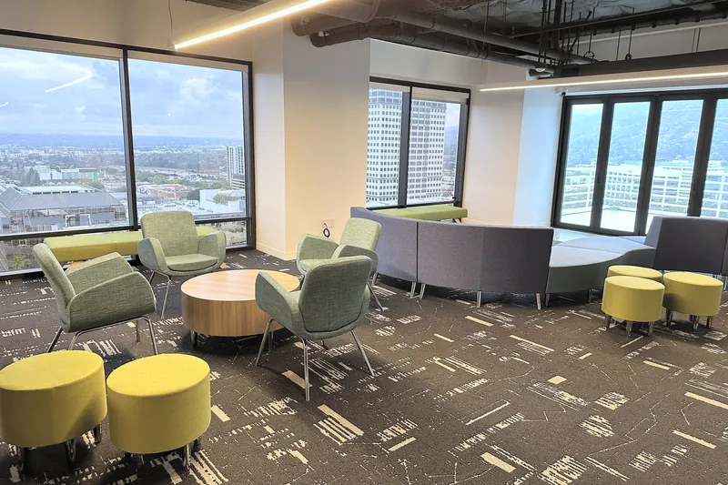 City-view lounge with sofas, lounge chairs and poufs, software company, Glendale