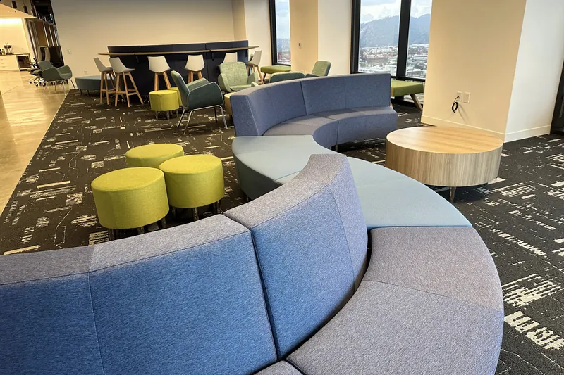 Curved modular sofa with poufs, software company, Glendale
