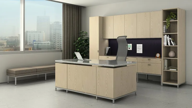 Private office with a wood-veneer desk, stone-look top, wall storage and an open bookcase, manufacturer photo
