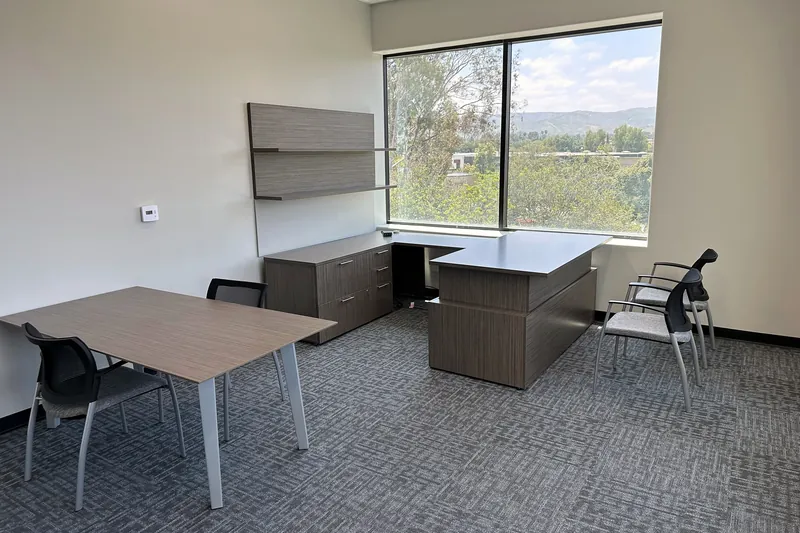Private office with executive desk and meeting table