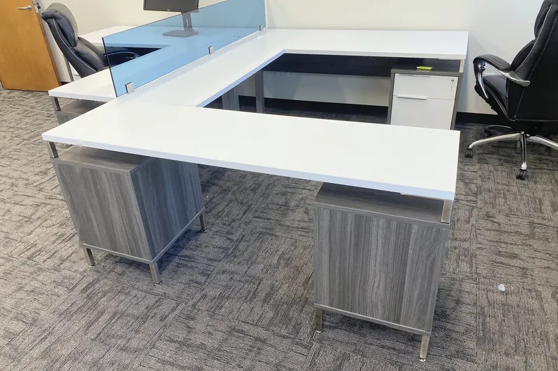 U-shaped executive desk with glass divider