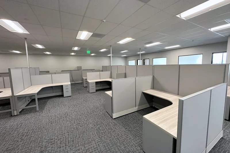 L-shaped panel workstations on an open office floor